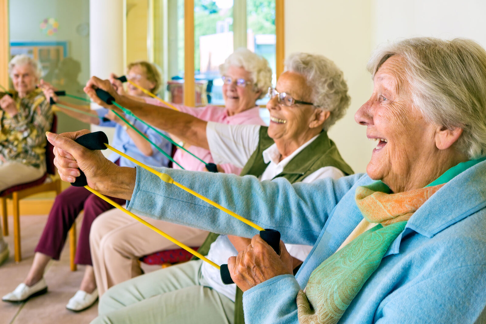 Group of senior women at an excercise class in their assisted living facility